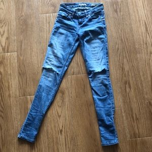 Blue jeans ripped at knees